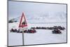 Snow Mobile Traffic Sign in Front of Snow Mobiles-Stephen Studd-Mounted Photographic Print