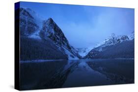 Snow on Lake Louise at Night, Very Early Morning Sunrise with the Mountains Reflecting in the Lake-sammyc-Stretched Canvas