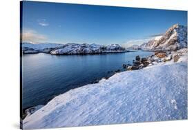 Snow over shore and mountains in winter, Lofoten Islands-Christophe Courteau-Stretched Canvas