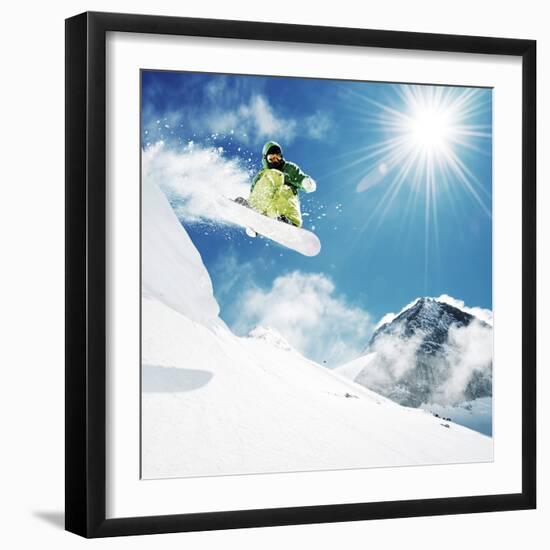 Snowboarder at Jump Inhigh Mountains at Sunny Day.-IM_photo-Framed Photographic Print