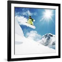 Snowboarder at Jump Inhigh Mountains at Sunny Day.-IM_photo-Framed Photographic Print