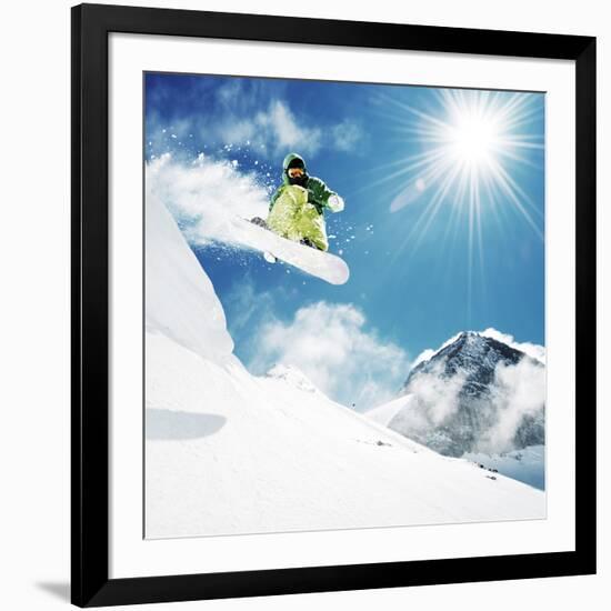 Snowboarder at Jump Inhigh Mountains at Sunny Day.-IM_photo-Framed Photographic Print