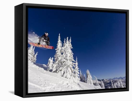 Snowboarding Action at Whitefish Mountain Resort in Whitefish, Montana, USA-Chuck Haney-Framed Stretched Canvas