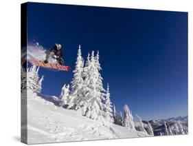Snowboarding Action at Whitefish Mountain Resort in Whitefish, Montana, USA-Chuck Haney-Stretched Canvas