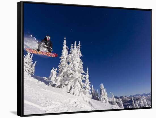 Snowboarding Action at Whitefish Mountain Resort in Whitefish, Montana, USA-Chuck Haney-Framed Stretched Canvas