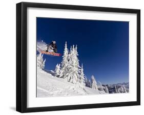 Snowboarding Action at Whitefish Mountain Resort in Whitefish, Montana, USA-Chuck Haney-Framed Premium Photographic Print