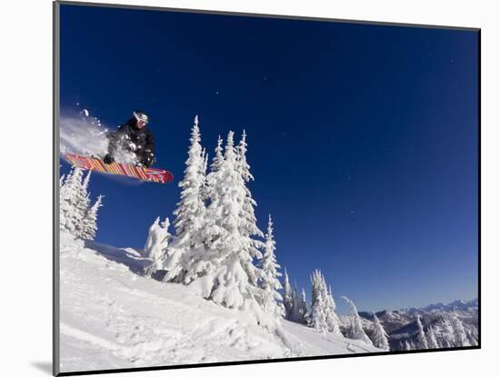 Snowboarding Action at Whitefish Mountain Resort in Whitefish, Montana, USA-Chuck Haney-Mounted Premium Photographic Print