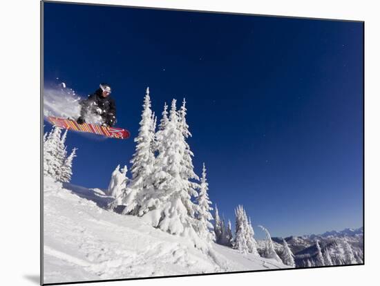 Snowboarding Action at Whitefish Mountain Resort in Whitefish, Montana, USA-Chuck Haney-Mounted Photographic Print