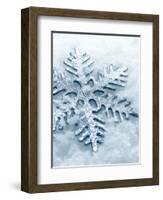 Snowflake Shaped Christmas Ornament Lying in the Snow-null-Framed Photographic Print