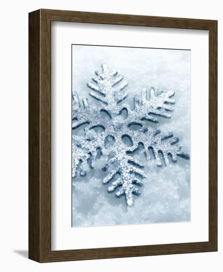 Snowflake Shaped Christmas Ornament Lying in the Snow-null-Framed Photographic Print