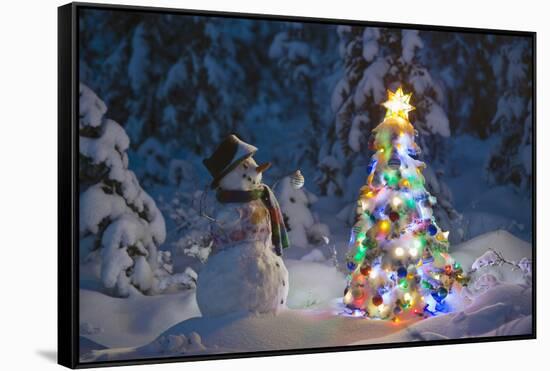 Snowman Standing In A Snow-Covered Spruce Forest Next To A Decorated Christmas Tree In Wintertime-Design Pics-Framed Stretched Canvas