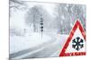 Snowy Curvy Road with Traffic Sign-trendobjects-Mounted Photographic Print