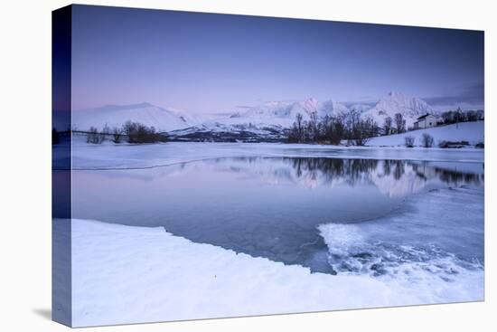 Snowy Peaks are Reflected in the Frozen Lake Jaegervatnet at Dusk, Lapland-Roberto Moiola-Stretched Canvas