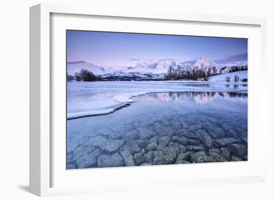 Snowy peaks are reflected in the frozen Lake Jaegervatnet at sunset Stortind Lyngen Alps Tromsa? La-ClickAlps-Framed Photographic Print