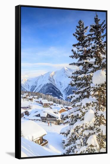 Snowy Woods and Mountain Huts Framed by the Winter Sunset, Bettmeralp, District of Raron-Roberto Moiola-Framed Stretched Canvas