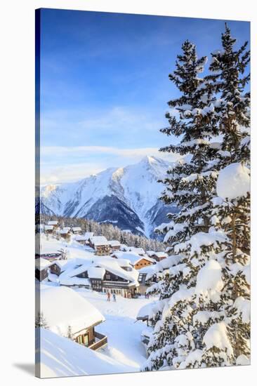 Snowy Woods and Mountain Huts Framed by the Winter Sunset, Bettmeralp, District of Raron-Roberto Moiola-Stretched Canvas