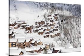 Snowy Woods Frame the Typical Alpine Village and Ski Resort, Bettmeralp, District of Raron-Roberto Moiola-Stretched Canvas