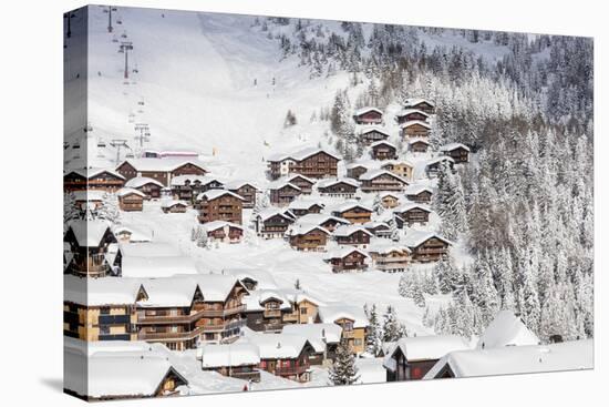 Snowy Woods Frame the Typical Alpine Village and Ski Resort, Bettmeralp, District of Raron-Roberto Moiola-Stretched Canvas