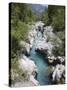 Soca River with Clear Emerald Water Flowing Between Eroded Rocks in Trenta Valley in Summer-Pearl Bucknall-Stretched Canvas