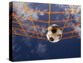 Soccer Ball Going Into Goal Net-Randy Faris-Stretched Canvas