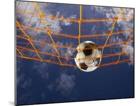 Soccer Ball Going Into Goal Net-Randy Faris-Mounted Premium Photographic Print