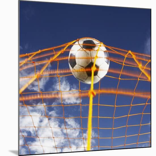 Soccer Ball Going Into Goal Net-Randy Faris-Mounted Photographic Print