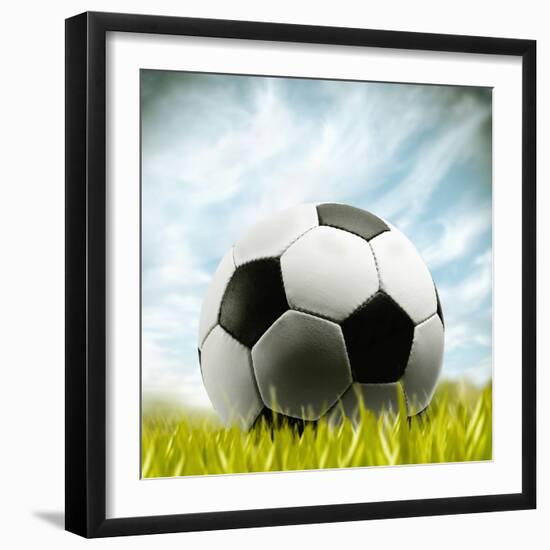 Soccer Ball Resting on Grass-null-Framed Premium Photographic Print