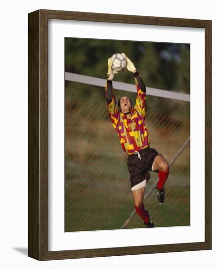 Soccer Goalie in Action-null-Framed Photographic Print