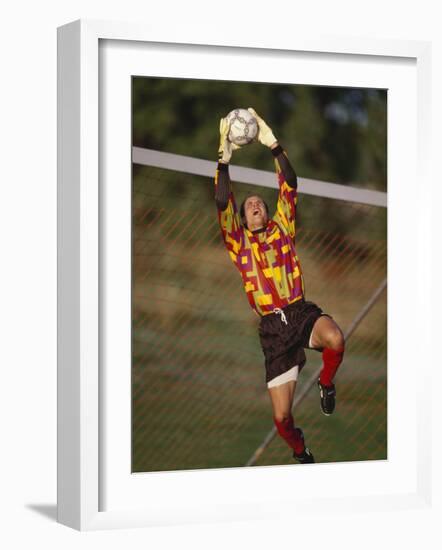 Soccer Goalie in Action-null-Framed Photographic Print