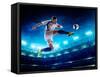 Soccer Player in Action on Night Stadium Background-Eugene Onischenko-Framed Stretched Canvas