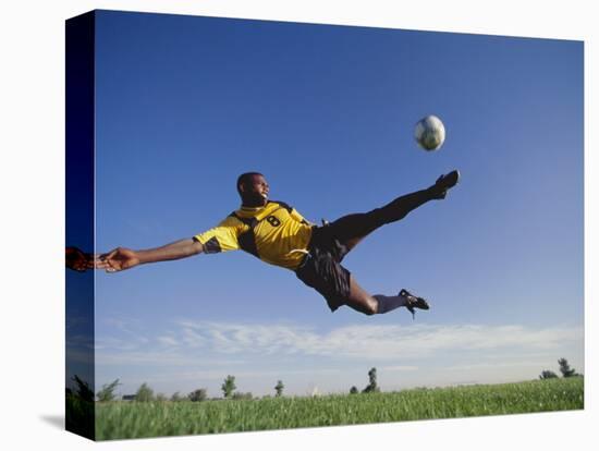 Soccer Player in Action-null-Stretched Canvas