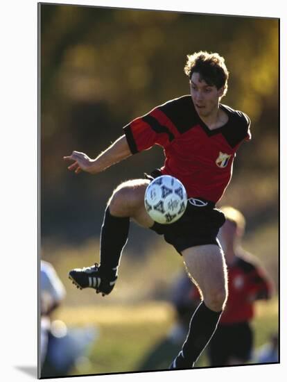 Soccer Player in Action-null-Mounted Photographic Print