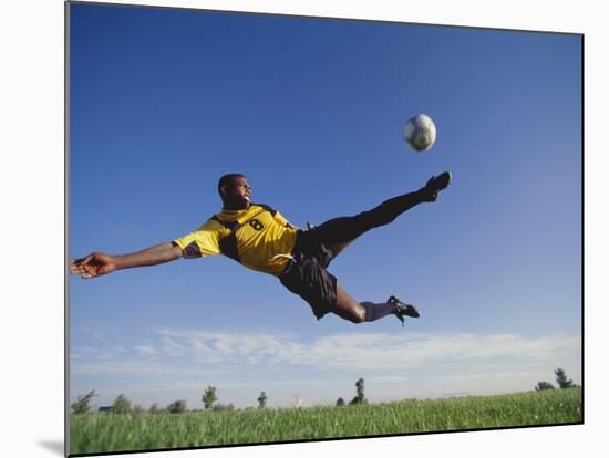 Soccer Player in Action-null-Mounted Photographic Print
