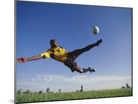 Soccer Player in Action-null-Mounted Photographic Print