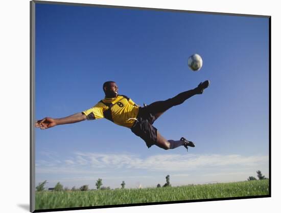 Soccer Player in Action-null-Mounted Photographic Print