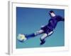 Soccer Player Jumping in Mid Air to Kick a Soccer Ball-null-Framed Photographic Print