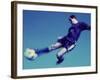 Soccer Player Jumping in Mid Air to Kick a Soccer Ball-null-Framed Photographic Print