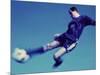 Soccer Player Jumping in Mid Air to Kick a Soccer Ball-null-Mounted Photographic Print