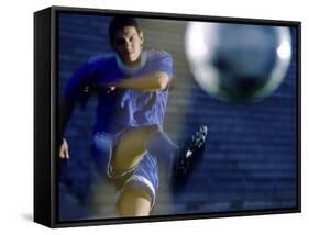 Soccer Player Kicking a Soccer Ball-null-Framed Stretched Canvas