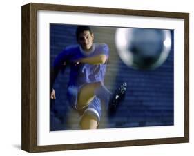 Soccer Player Kicking a Soccer Ball-null-Framed Premium Photographic Print