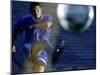 Soccer Player Kicking a Soccer Ball-null-Mounted Premium Photographic Print