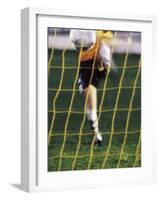 Soccer Player Kicking a Soccer Ball-null-Framed Photographic Print