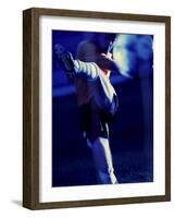 Soccer Player Kicking a Soccer Ball-null-Framed Photographic Print