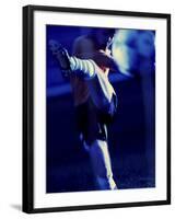 Soccer Player Kicking a Soccer Ball-null-Framed Photographic Print