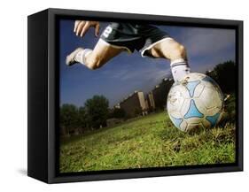 Soccer Player Kicking Ball-Randy Faris-Framed Stretched Canvas