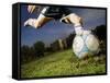 Soccer Player Kicking Ball-Randy Faris-Framed Stretched Canvas