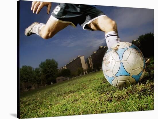 Soccer Player Kicking Ball-Randy Faris-Stretched Canvas