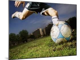 Soccer Player Kicking Ball-Randy Faris-Mounted Photographic Print