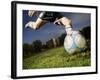 Soccer Player Kicking Ball-Randy Faris-Framed Photographic Print