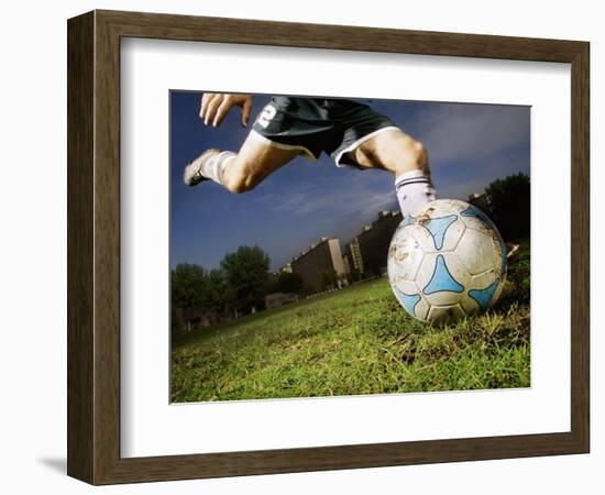 Soccer Player Kicking Ball-Randy Faris-Framed Photographic Print